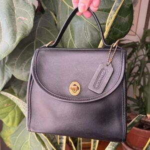 SOLD.          Vintage Coach 1996 Black Regina 9983 with brass hardware